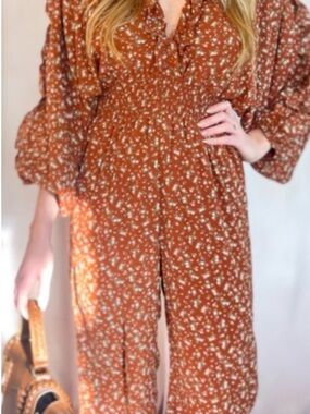 Storia Boutique rust colored floral jumpsuit